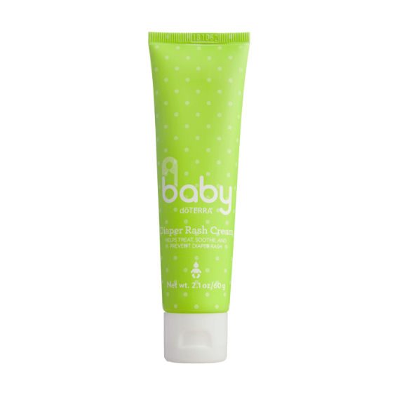 A tube of dôTERRA Baby Diaper Rash Cream with a green and white label, featuring essential oils and shea butter.
