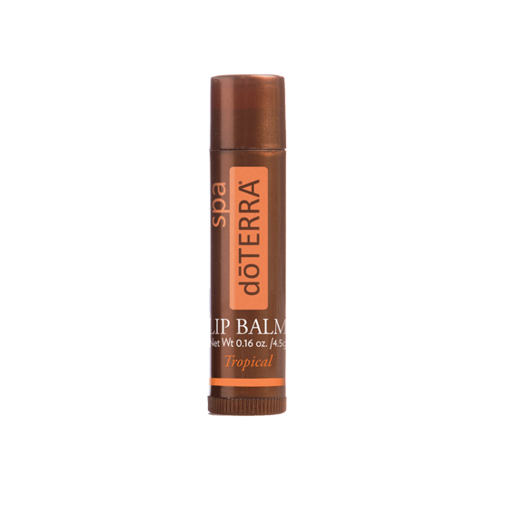 A tube of dôTERRA Spa Lip Balm (Tropical) with orange and brown color scheme.