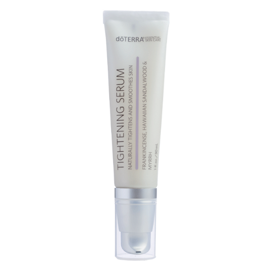 A tube of doTERRA Tightening Serum with white and purple labeling, indicating the product is formulated with essential oils.